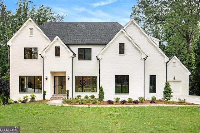 4757 Lake Forrest Dr NW, Atlanta, GA 30342 - view of front of house with a front lawn, concrete driveway, and a shingled roof