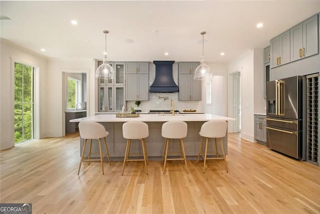 4757 Lake Forrest Dr NW, Atlanta, GA 30342 - kitchen with high end refrigerator, premium range hood, gray cabinetry, light countertops, and recessed lighting