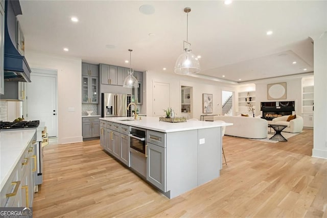4757 Lake Forrest Dr NW, Atlanta, GA 30342 - kitchen featuring gray cabinetry, appliances with stainless steel finishes, recessed lighting, light countertops, and decorative backsplash