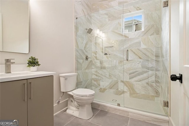 4757 Lake Forrest Dr NW, Atlanta, GA 30342 - bathroom with vanity, toilet, a shower stall, tile patterned flooring, and baseboards