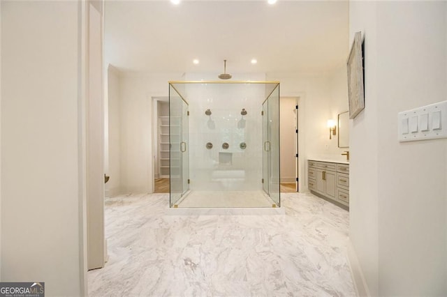 4757 Lake Forrest Dr NW, Atlanta, GA 30342 - bathroom with a shower stall, recessed lighting, vanity, and marble look tile flooring