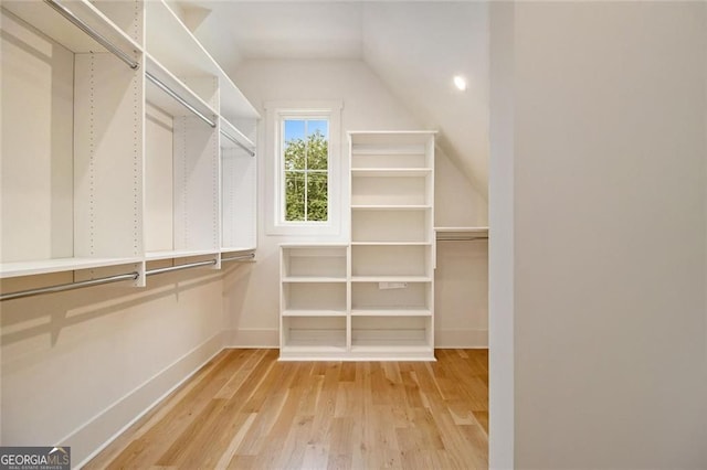 4757 Lake Forrest Dr NW, Atlanta, GA 30342 - spacious closet with lofted ceiling and light wood-style flooring