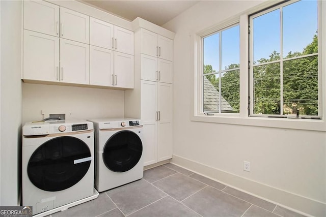 4757 Lake Forrest Dr NW, Atlanta, GA 30342 - laundry area with cabinet space, washing machine and clothes dryer, baseboards, and light tile patterned floors