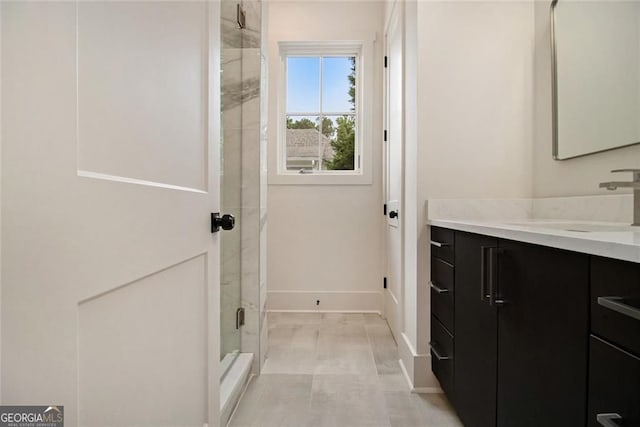 4757 Lake Forrest Dr NW, Atlanta, GA 30342 - bathroom featuring vanity, a shower stall, and baseboards