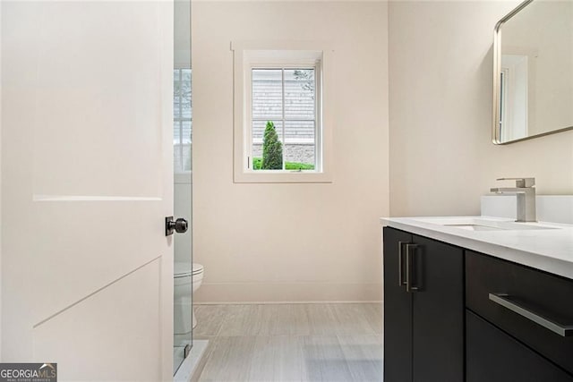 4757 Lake Forrest Dr NW, Atlanta, GA 30342 - full bathroom featuring vanity, baseboards, and toilet