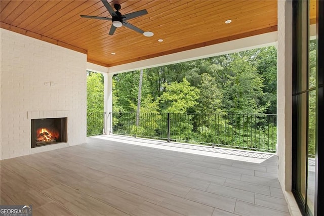 4757 Lake Forrest Dr NW, Atlanta, GA 30342 - view of patio with an outdoor brick fireplace and a ceiling fan