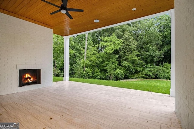 4757 Lake Forrest Dr NW, Atlanta, GA 30342 - deck featuring an outdoor brick fireplace, ceiling fan, and a patio