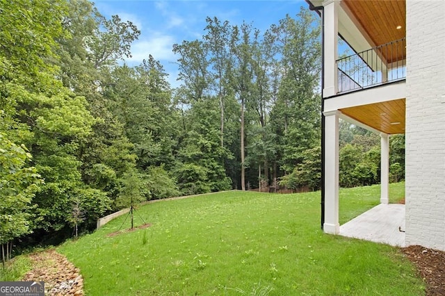 4757 Lake Forrest Dr NW, Atlanta, GA 30342 - view of grassy yard with a balcony and a patio area