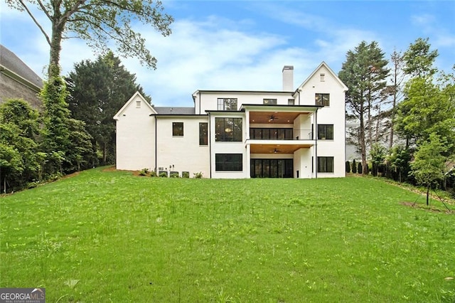4757 Lake Forrest Dr NW, Atlanta, GA 30342 - rear view of property with a yard, a chimney, a balcony, and stucco siding