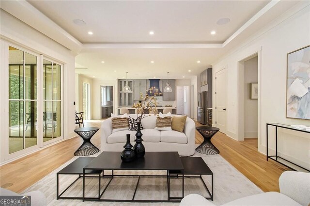4757 Lake Forrest Dr NW, Atlanta, GA 30342 - living area featuring light wood finished floors, crown molding, baseboards, and recessed lighting