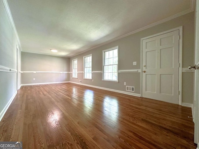 120 Watson Dr, Athens, GA 30605 - unfurnished living room featuring crown molding, wood finished floors, and baseboards