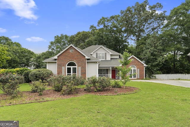 2881 Bridle Creek Dr SW, Conyers, GA 30094 - traditional-style house with brick siding and view of scattered trees