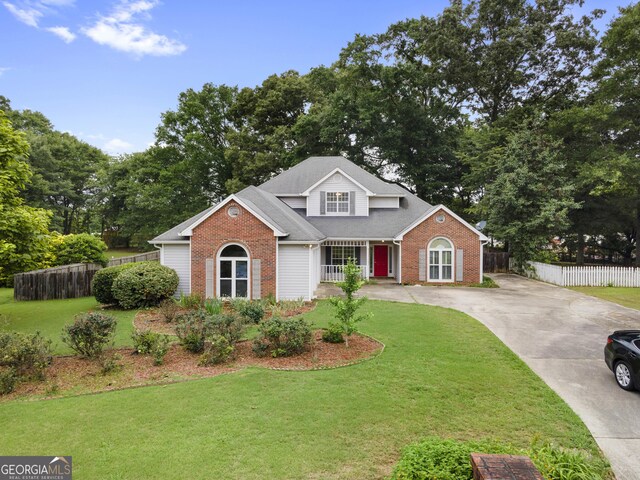 2881 Bridle Creek Dr SW, Conyers, GA 30094 - traditional-style home with brick siding, driveway, and a porch