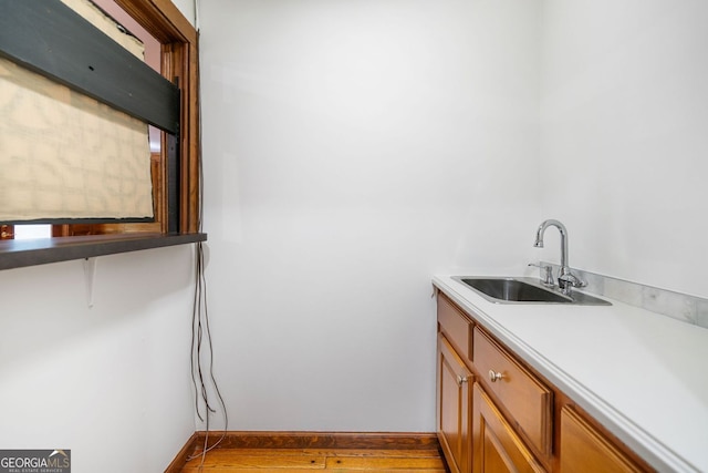 2717 Hearthstone Cir, Marietta, GA 30062 - washroom featuring a sink and wood finished floors