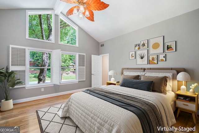 2717 Hearthstone Cir, Marietta, GA 30062 - bedroom with high vaulted ceiling, wood finished floors, multiple windows, and ceiling fan