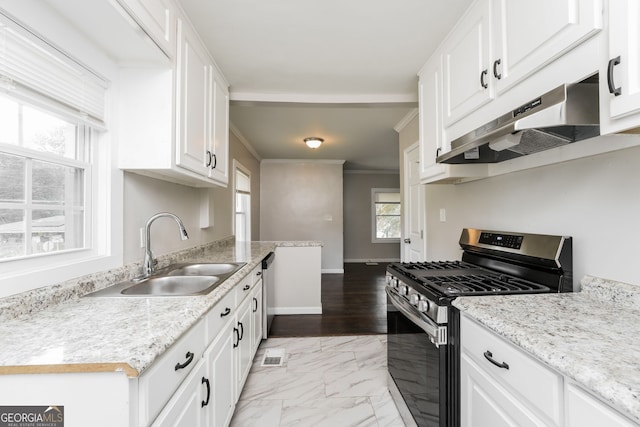 1381 Benteen Way SE, Atlanta, GA 30315 - kitchen featuring stainless steel gas range, under cabinet range hood, white cabinetry, light marble finish floors, and ornamental molding
