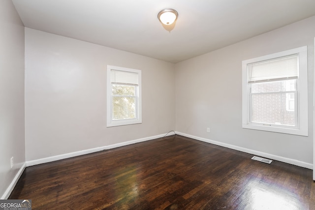 1381 Benteen Way SE, Atlanta, GA 30315 - unfurnished room featuring baseboards and dark wood-style floors