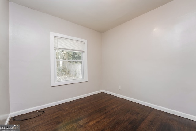 1381 Benteen Way SE, Atlanta, GA 30315 - spare room with baseboards and dark wood-style flooring