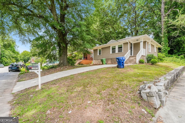 1381 Benteen Way SE, Atlanta, GA 30315 - view of front facade featuring driveway, brick siding, and a front yard