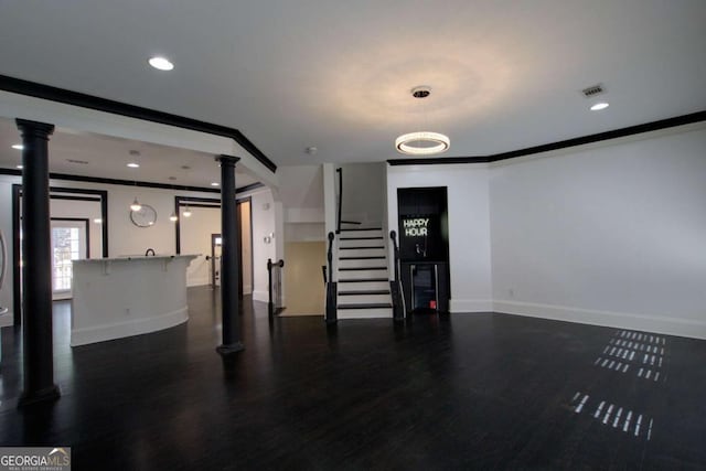 2767 Durham Dr NE, Atlanta, GA 30319 - unfurnished living room with decorative columns, baseboards, dark wood finished floors, stairway, and recessed lighting