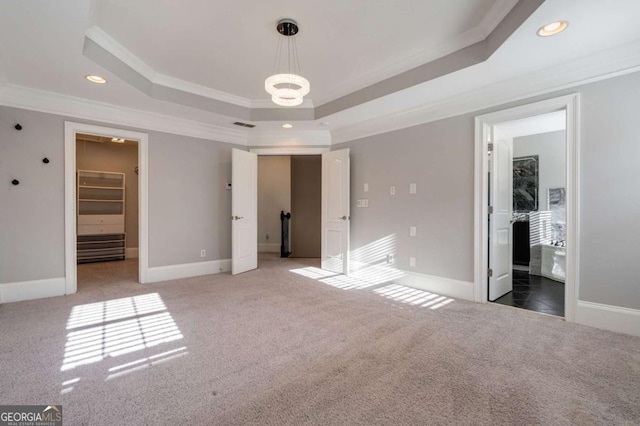 2767 Durham Dr NE, Atlanta, GA 30319 - unfurnished bedroom with a raised ceiling, crown molding, light carpet, recessed lighting, and baseboards