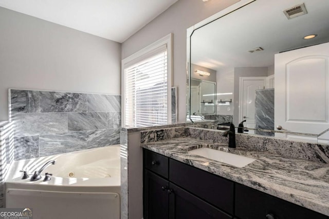 2767 Durham Dr NE, Atlanta, GA 30319 - bathroom with vanity and a jetted tub
