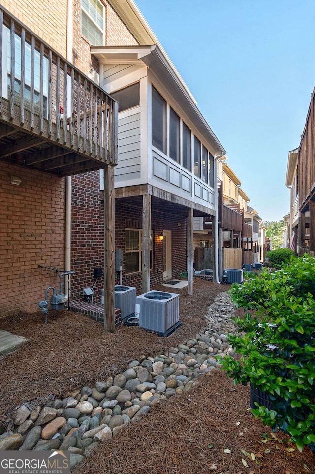 2767 Durham Dr NE, Atlanta, GA 30319 - back of house with central AC unit and brick siding