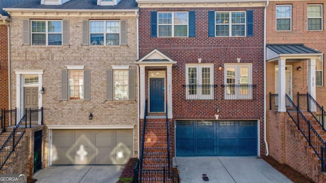 2767 Durham Dr NE, Atlanta, GA 30319 - view of property with a garage, concrete driveway, and brick siding