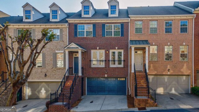 2767 Durham Dr NE, Atlanta, GA 30319 - multi unit property featuring an attached garage and brick siding