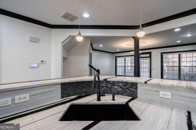 2767 Durham Dr NE, Atlanta, GA 30319 - bathroom with crown molding, a sink, ornate columns, healthy amount of natural light, and recessed lighting
