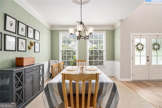 525 Arbor Creek Ct, Roswell, GA 30076 - dining area with a chandelier, light wood finished floors, wainscoting, ornamental molding, and french doors