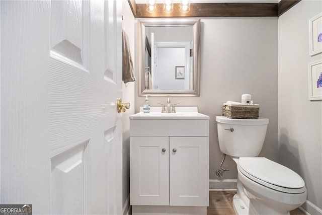 525 Arbor Creek Ct, Roswell, GA 30076 - half bathroom featuring toilet, baseboards, and vanity