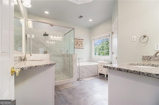525 Arbor Creek Ct, Roswell, GA 30076 - bathroom featuring two vanities, a garden tub, a marble finish shower, tile patterned flooring, and recessed lighting