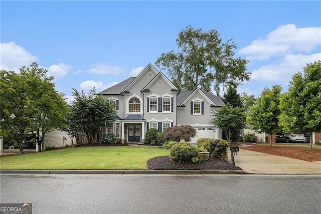 525 Arbor Creek Ct, Roswell, GA 30076 - traditional-style house with driveway, a garage, a front yard, and stucco siding