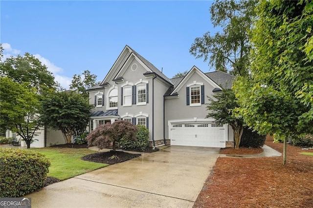 525 Arbor Creek Ct, Roswell, GA 30076 - view of front of property with an attached garage, concrete driveway, and stucco siding