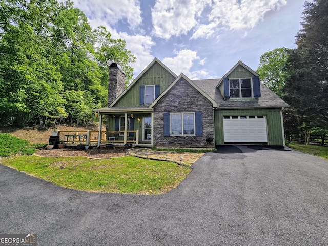 726 Gage Dr, Hiawassee, GA 30546 - view of front of property with a chimney, covered porch, driveway, and an attached garage