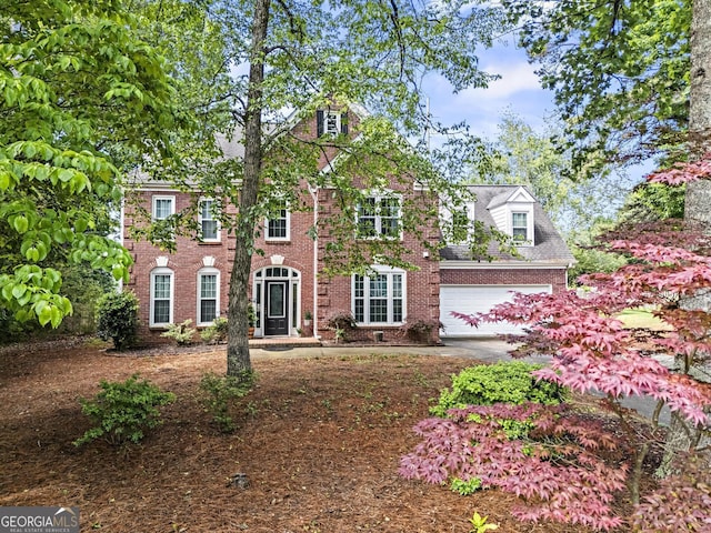 4365 Wicklow Ct, Suwanee, GA 30024 - view of front of home with brick siding and an attached garage