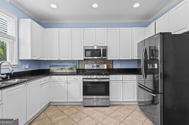 4365 Wicklow Ct, Suwanee, GA 30024 - kitchen with stainless steel appliances, a sink, white cabinets, ornamental molding, and light tile patterned flooring