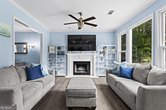 4365 Wicklow Ct, Suwanee, GA 30024 - living room with ceiling fan, ornamental molding, dark wood-style floors, and a fireplace with flush hearth
