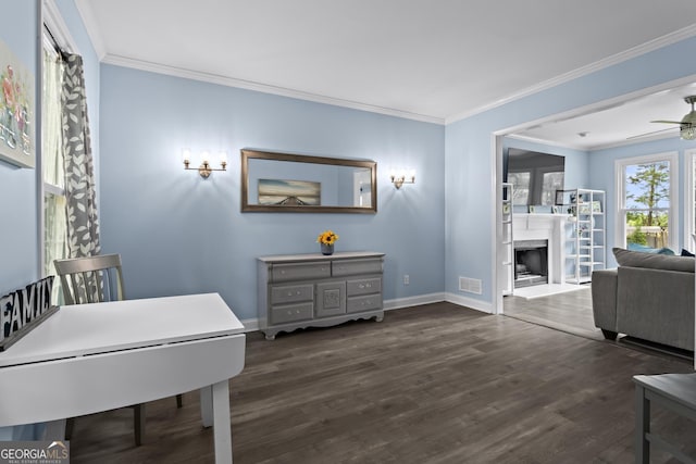 4365 Wicklow Ct, Suwanee, GA 30024 - interior space featuring dark wood-style flooring, crown molding, baseboards, ceiling fan, and a fireplace with raised hearth