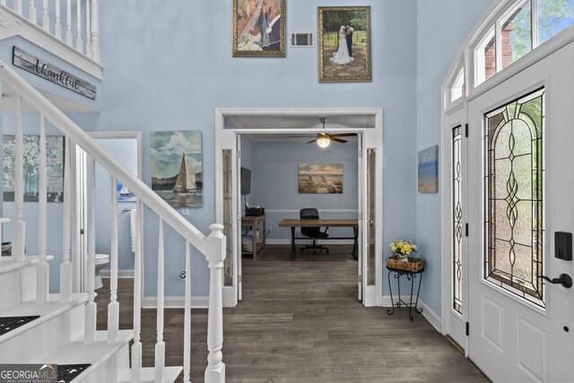 4365 Wicklow Ct, Suwanee, GA 30024 - entryway featuring a towering ceiling, stairway, wood finished floors, baseboards, and a ceiling fan