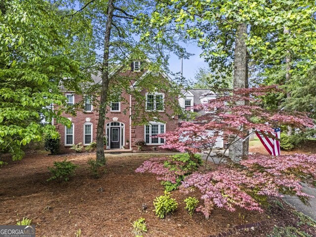 4365 Wicklow Ct, Suwanee, GA 30024 - view of front facade featuring brick siding