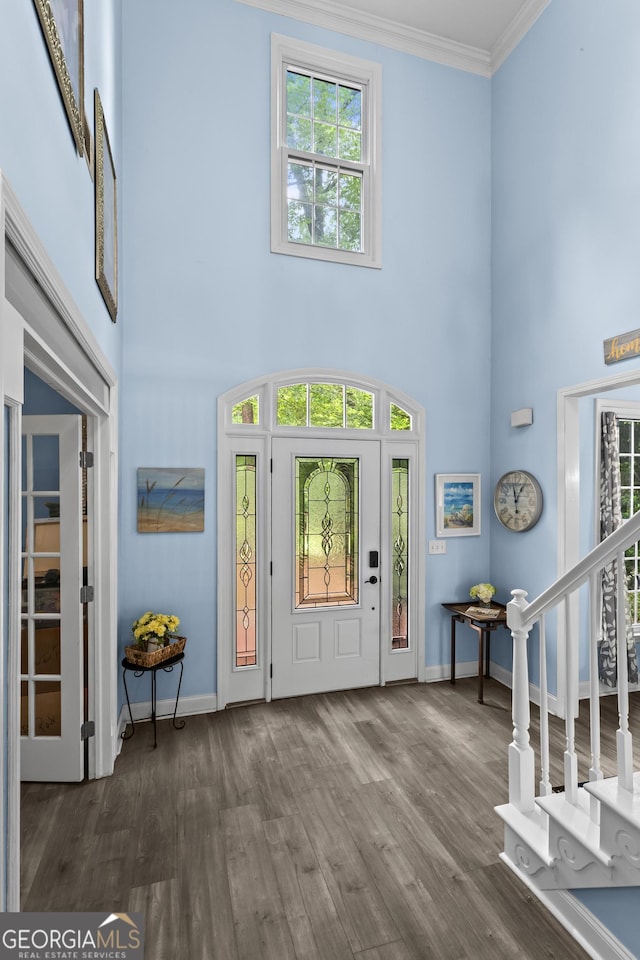 4365 Wicklow Ct, Suwanee, GA 30024 - entrance foyer with healthy amount of natural light, baseboards, a towering ceiling, wood finished floors, and crown molding