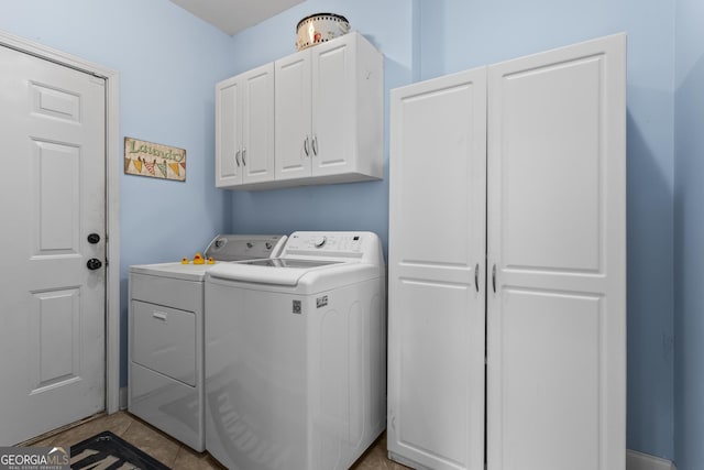 4365 Wicklow Ct, Suwanee, GA 30024 - laundry room with washing machine and clothes dryer and cabinet space