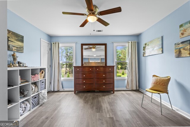 4365 Wicklow Ct, Suwanee, GA 30024 - living area with a ceiling fan, wood finished floors, and baseboards