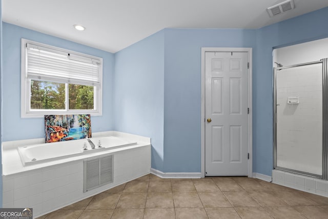 4365 Wicklow Ct, Suwanee, GA 30024 - bathroom with a bath, a shower stall, tile patterned flooring, and baseboards