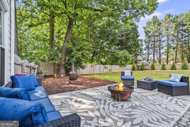 4365 Wicklow Ct, Suwanee, GA 30024 - view of patio with an outdoor living space with a fire pit