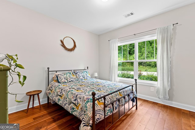 19 E Murphy St, Newnan, GA 30263 - bedroom featuring baseboards and wood-type flooring