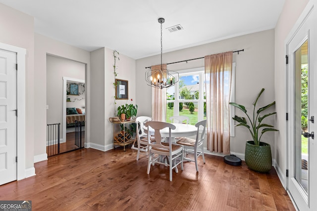 19 E Murphy St, Newnan, GA 30263 - dining room with wood finished floors, healthy amount of natural light, and a chandelier