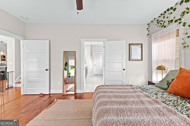 19 E Murphy St, Newnan, GA 30263 - bedroom with wood finished floors, baseboards, and a ceiling fan